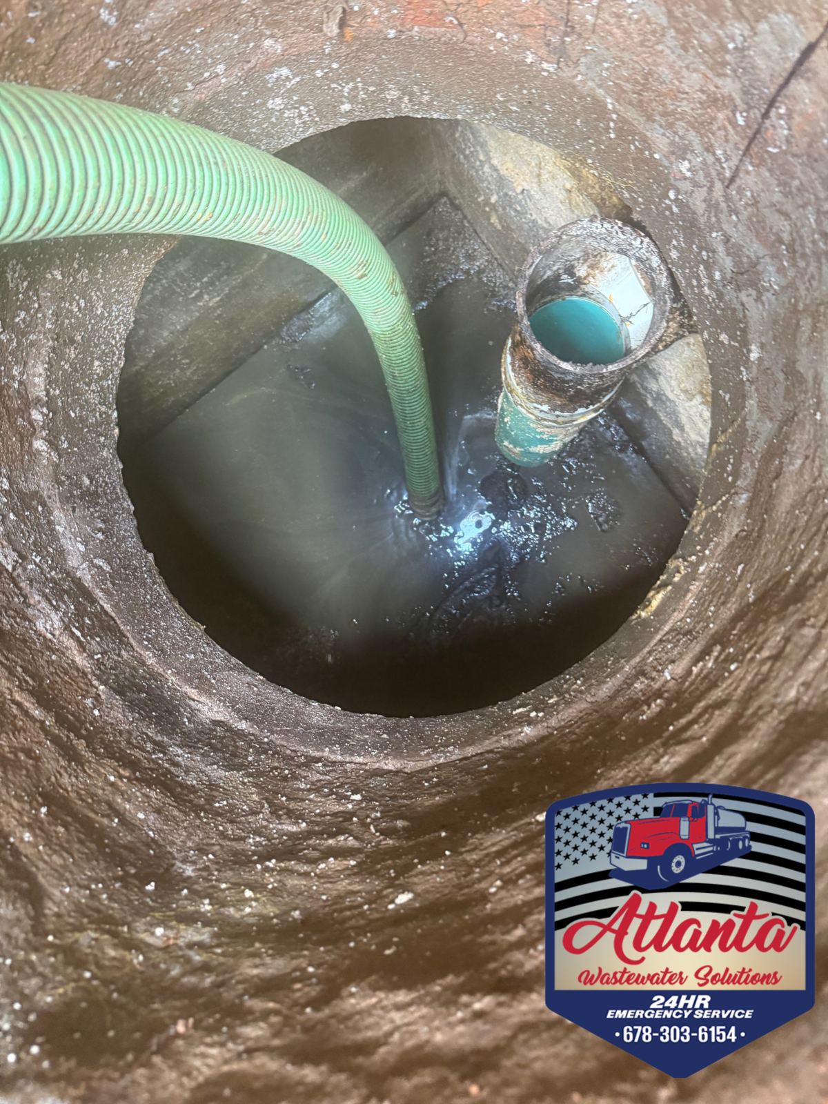 Septic tank pumped clean with a green suction hose, Atlanta Wastewater Solutions sticker visible