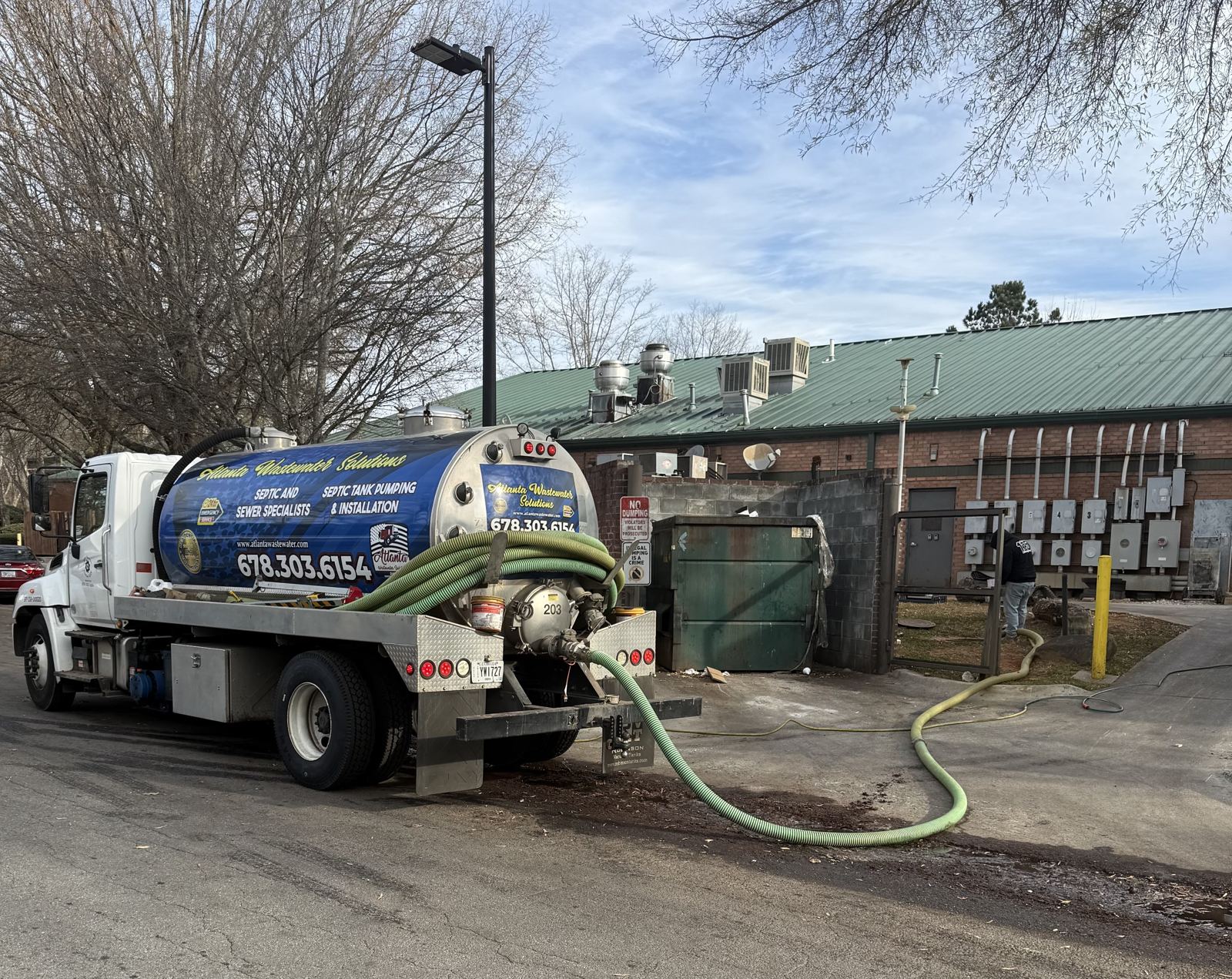 Atlanta Wastewater Solutions pump truck servicing a commercial property