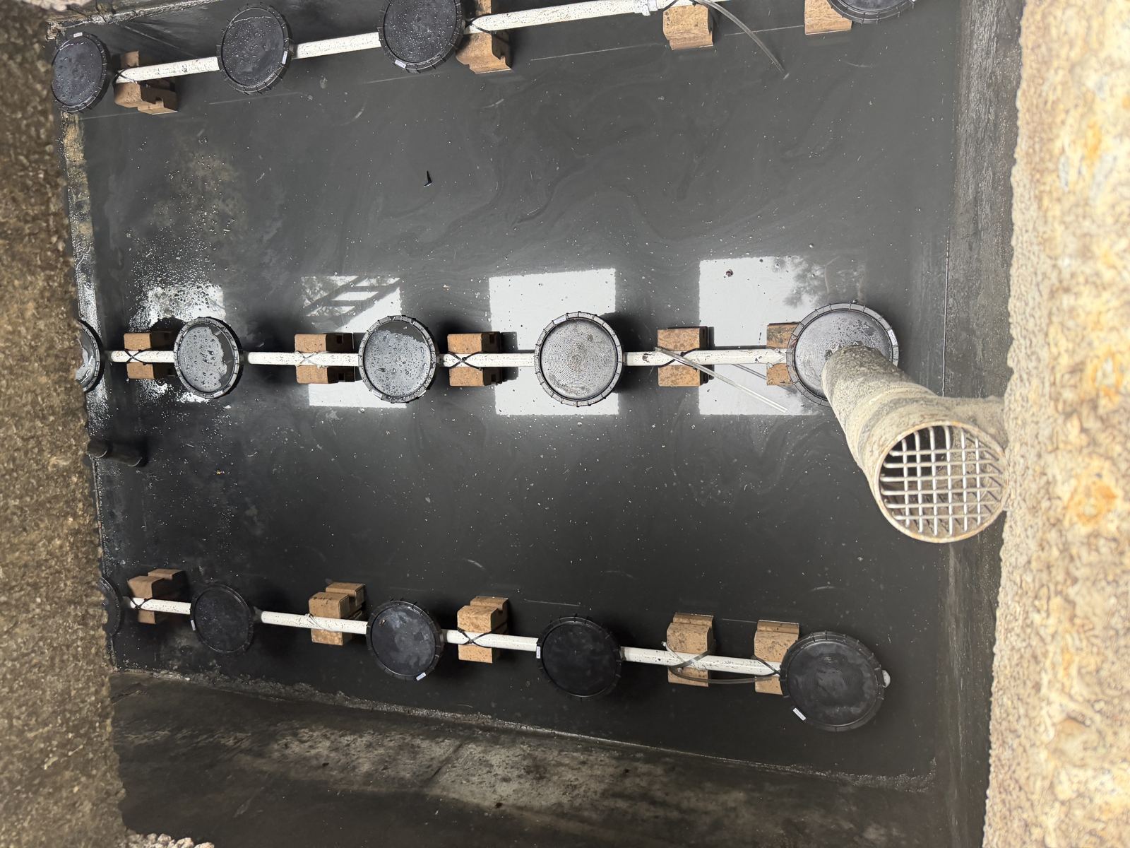 Flexible septic distribution pipe fitting laid in a trench — Lift Station Repair in Hall County, GA