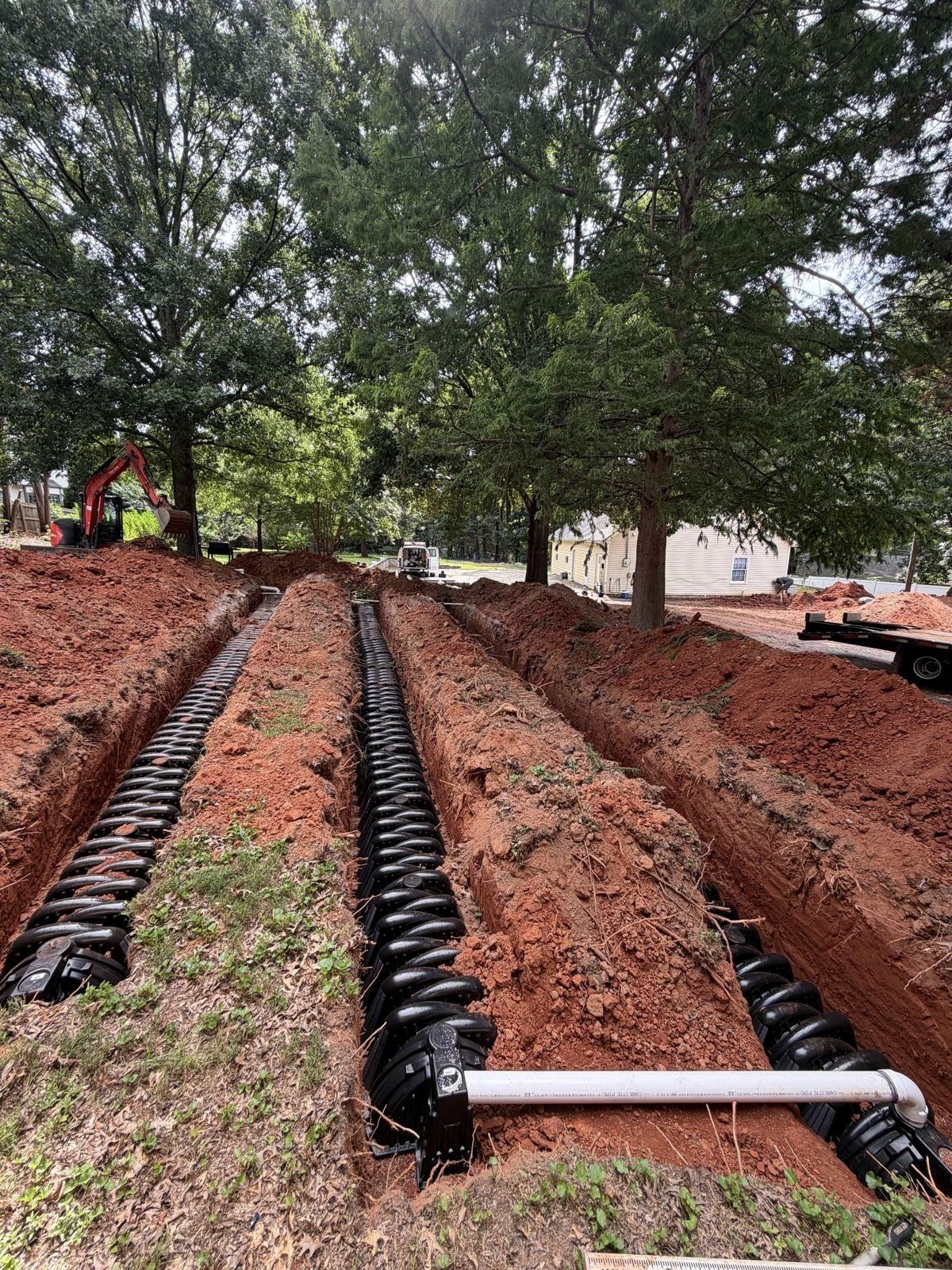 Drainfield trench with protective cover laid over new pipe — Grease Trap Pumping in Gainesville, GA
