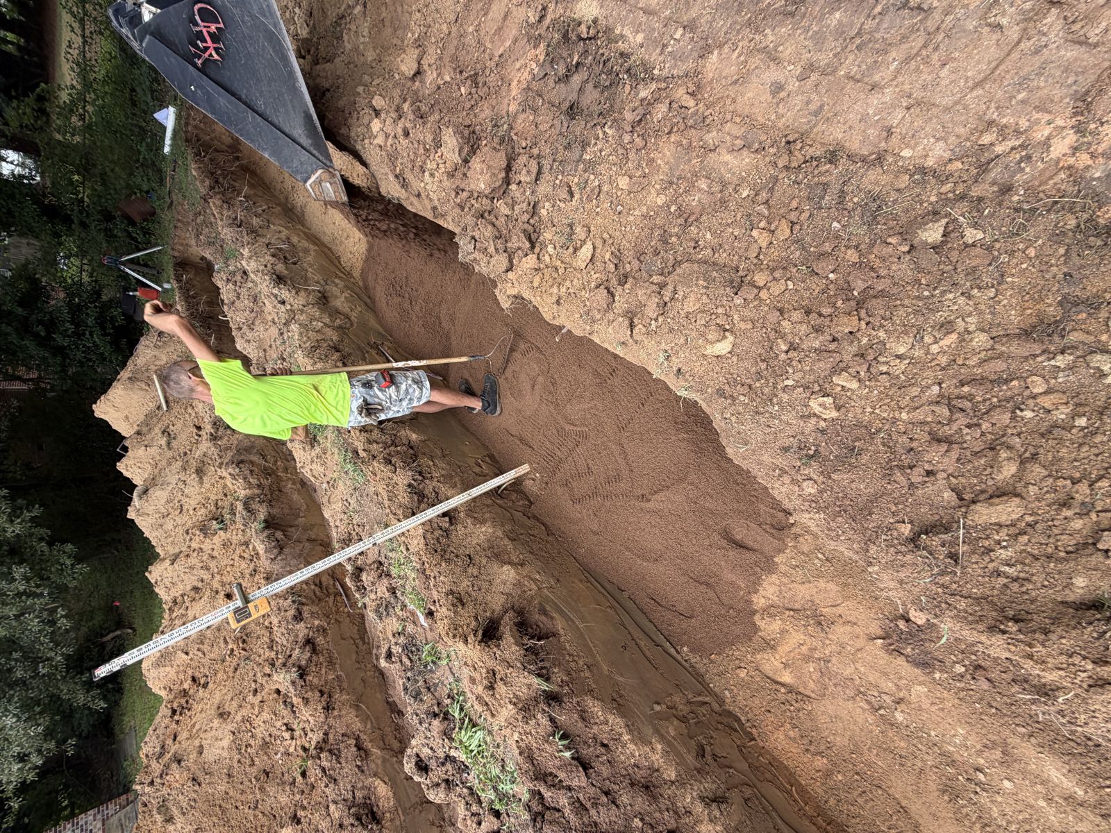 Crew installing septic pipe in a residential trench — Septic Tank Pumping in Lawrenceville, GA