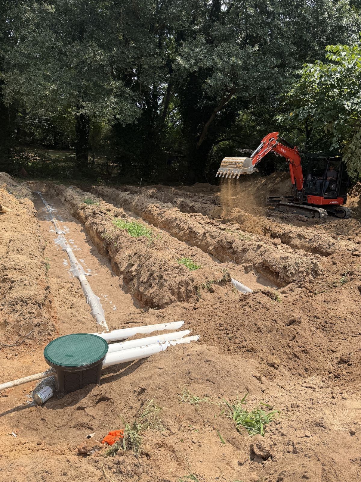 Septic tank access connected with hose during a service call — Septic Tank Cleaning in Flowery Branch, GA