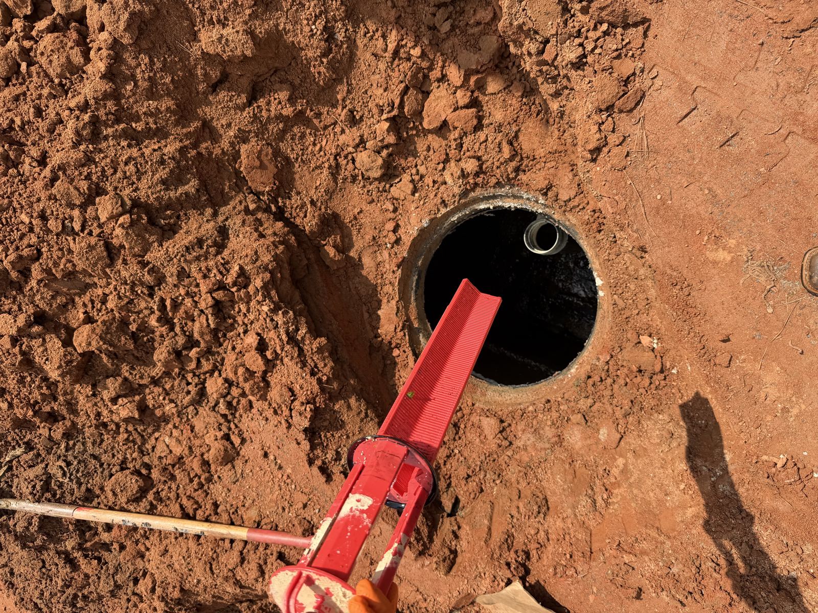 Aerial view of commercial utility work with excavation and truck on-site — Septic Tank Cleaning in Dawson County, GA