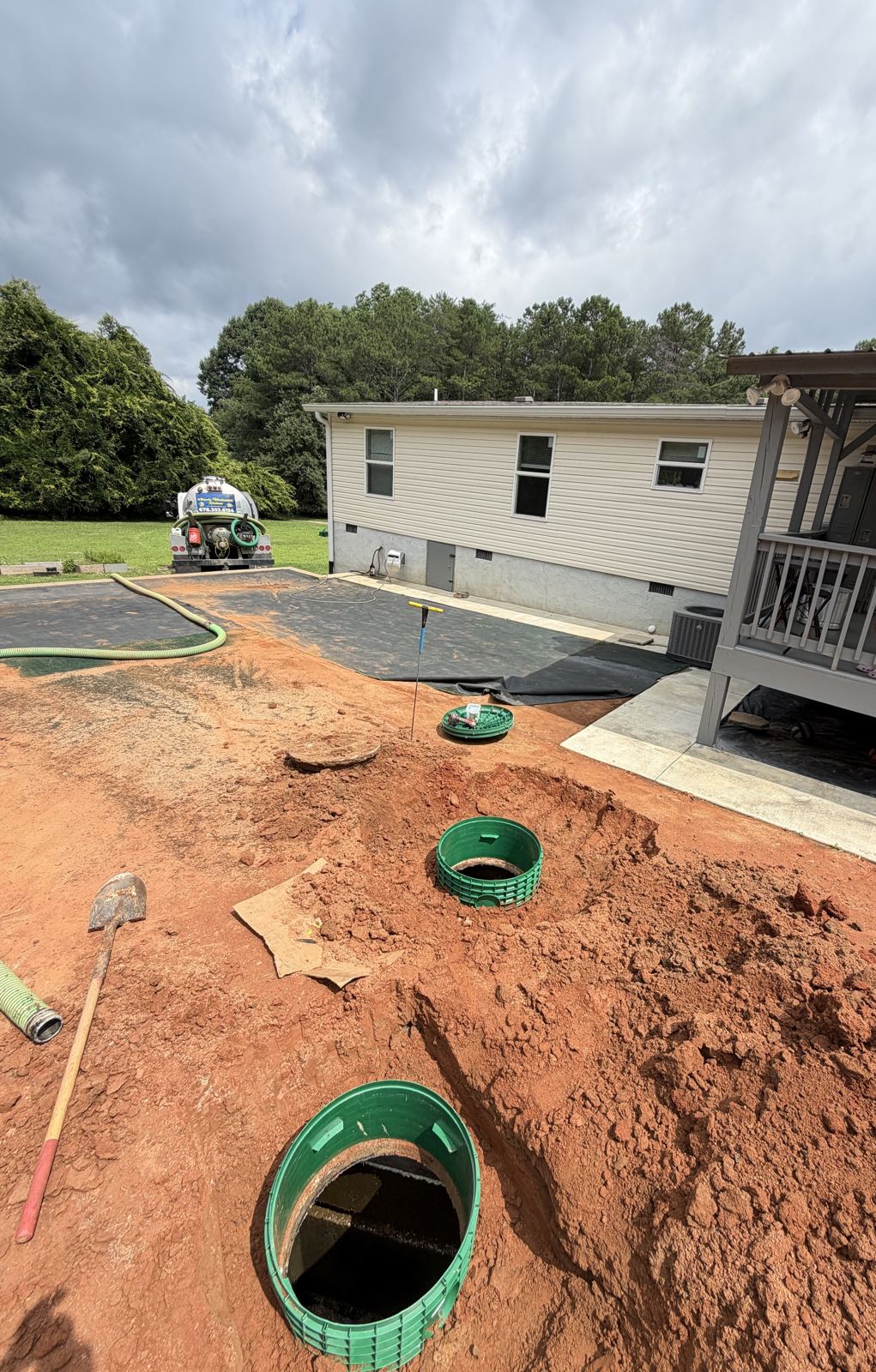 Aerial view of a red-clay excavation for a septic system — Drainfield Repair in Hall County, GA