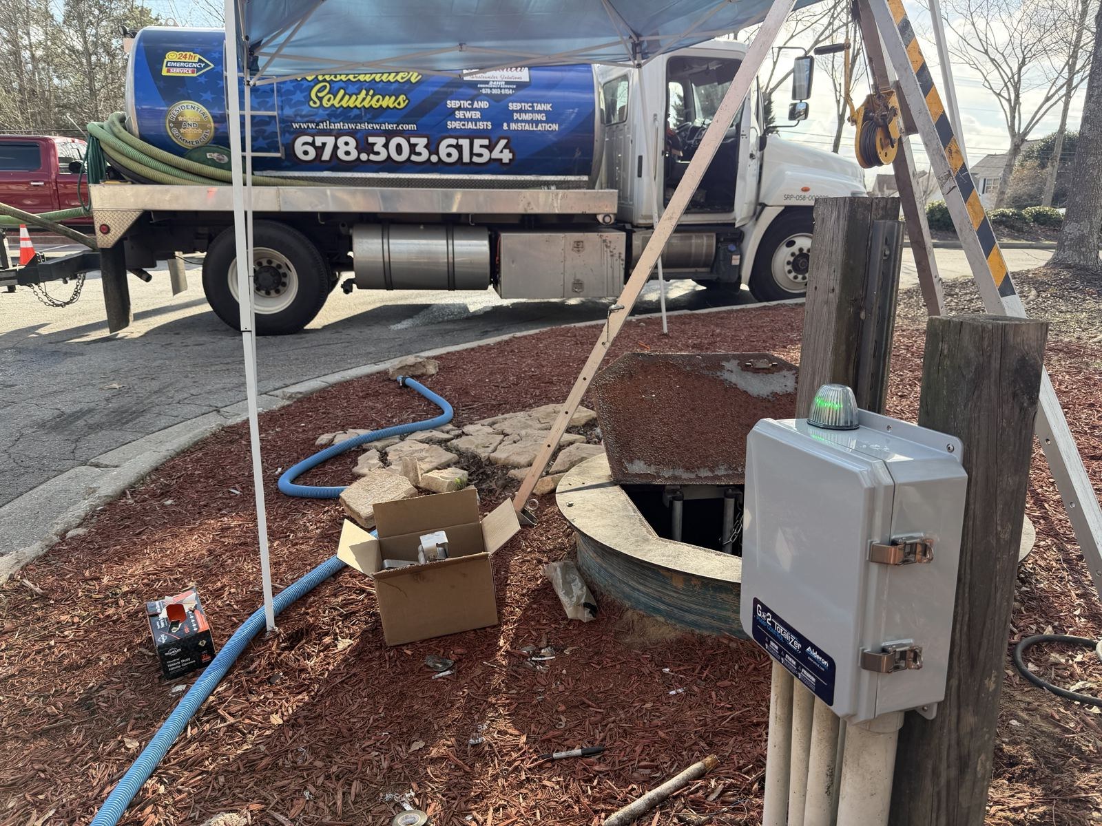 Septic service truck staged on a residential street — Eljen Septic Systems in Dawson County, GA