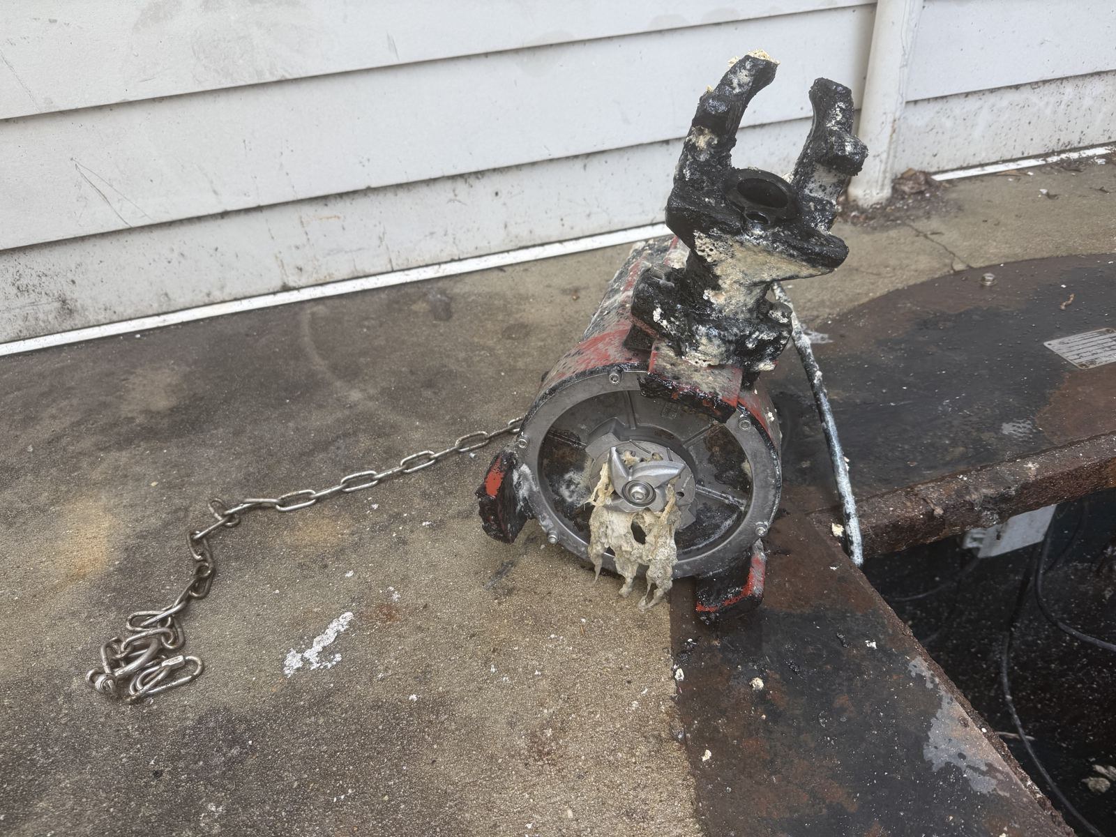 Crew completing a septic install near a residential curb